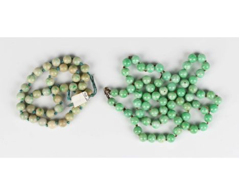 A single row necklace of jade beads, length 72cm (requires re-stringing), two loose jade beads and another single row necklac