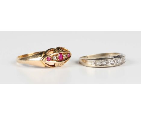 An 18ct gold, ruby and diamond five stone ring in a boat shaped setting with pierced decoration, Birmingham 1917, ring size a