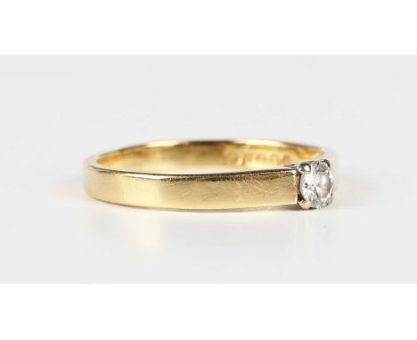 An 18ct gold and diamond single stone ring, claw set with a circular cut diamond, London 1984, weight 1.7g, ring size approx 