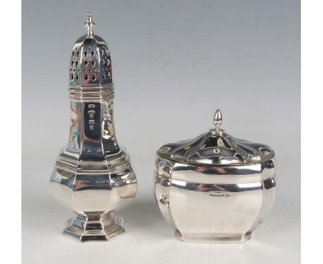 A silver tea caddy of oval form with canted sides beneath a similarly decorated domed hinged lid, marks rubbed, by Walker &am