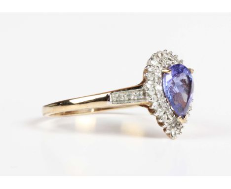 A 9ct gold ring, claw set with a pear shaped tanzanite within a colourless zircon two tier surround, weight 2.7g, ring size a