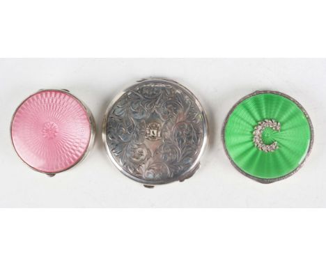 A George V silver and pink enamelled circular powder compact, Birmingham 1927 by Adie Brothers Ltd, diameter 5cm, a similar s