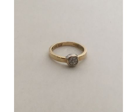 A circular 14 carat gold diamond cluster ring. Approx. 2.5 grams. Est. £70 - £80.
