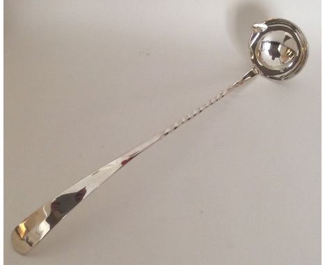A large silver plated toddy ladle with twisted handle. Est. £10 - £20.