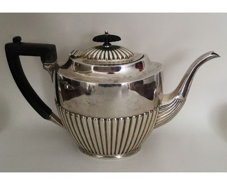 A large silver half fluted teapot with reeded decoration. Sheffield. By JR. Approx. 643 grams. Est. £200 - £300.