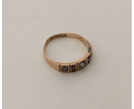 A Victorian 15 carat ruby and pearl ring. Approx. 2.1 grams. Est. £50 - £80.