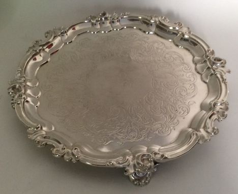 A good Victorian silver salver with chased border and scroll feet. London 1844. By Charles Rawlings. Approx. 548 grams. Est. 