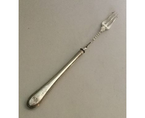 A silver pickle fork with bead handle. Sheffield. By RM. Approx. 28 grams. Est. £15 - £20.