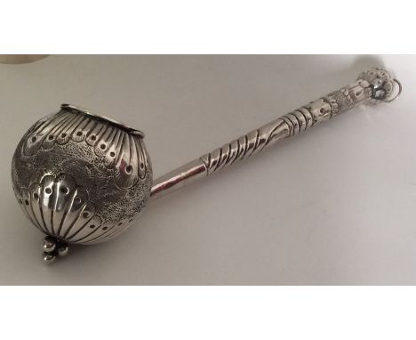 A large Continental silver ladle chased with flowers and leaves with fluted decoration. Approx. 131 grams. Est. £80 - £120.