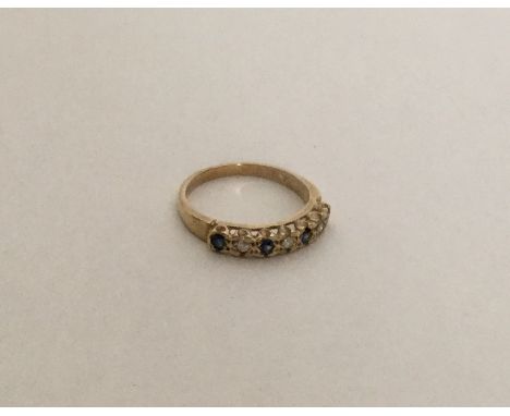 A 9 carat sapphire and diamond half eternity ring in claw mount. Approx. 2 grams. Est. £45 - £55.