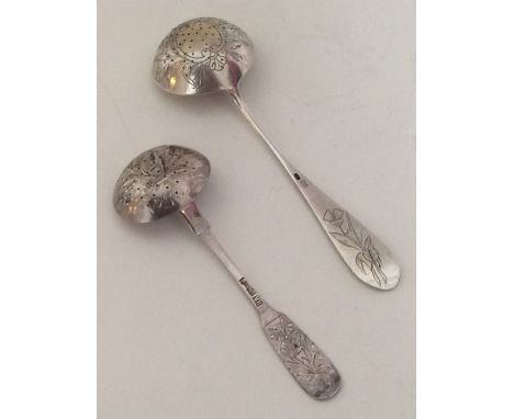 Two Russian silver sifter ladles. Approx. 65 grams. Est. £30 - £40.
