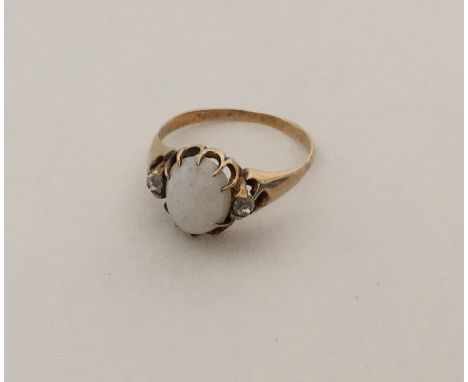 An opal and diamond gypsy set ring in claw mount. Approx. 3.3 grams. Est. £80 - £120.