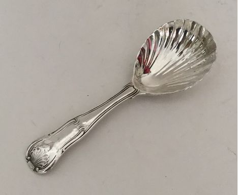 A silver hourglass pattern silver caddy spoon. London 1815. By Eley &amp; Fearne. Approx. 35 grams. Est. £45 - £55.