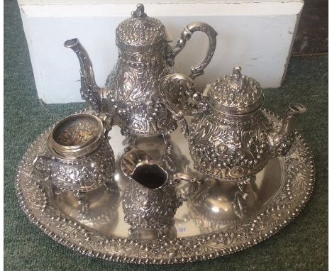 A heavy Continental silver five piece tea and coffee service on tray attractively decorated with swags and flowers. Approx. 4