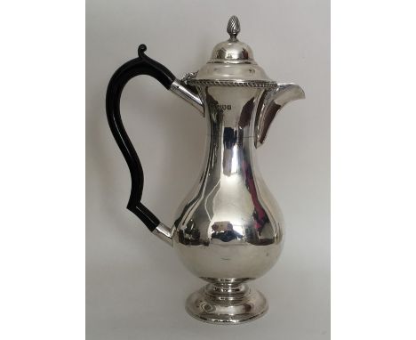 A slender silver hot water jug with gadroon rim. London. By C&amp;F. Approx. 463 grams. Est. £150 - £200.