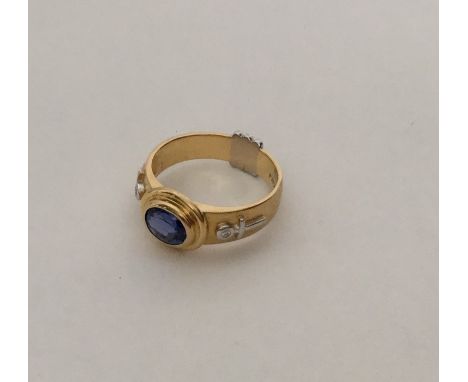 A good quality 18 carat two colour gold sapphire and diamond ring in rubover mount. Approx. 9 grams. Est. £300 - £400.