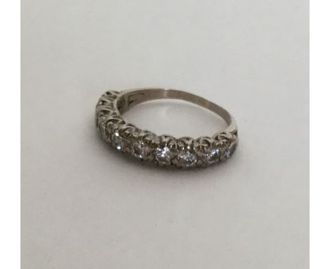 A good diamond half eternity ring in rubover mount. Approx. 4 grams. Est. £100 - £200.
