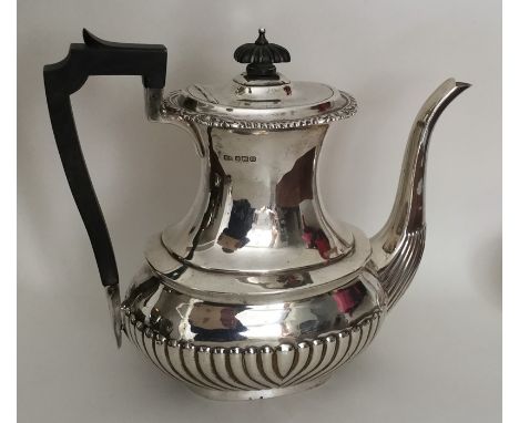 A large silver half fluted coffee pot with gadroon rim. Sheffield. By HA. Approx. 631 grams. Est. £200 - £300.