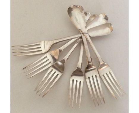 A good set of six fiddle pattern silver table forks with crested terminals. London. By MC. Approx. 446 grams. Est. £130 - £15