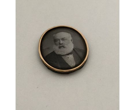 A Victorian enamelled monochrome portrait miniature in gold edged frame. Approx. 7.4 grams. Est. £45 - £50.