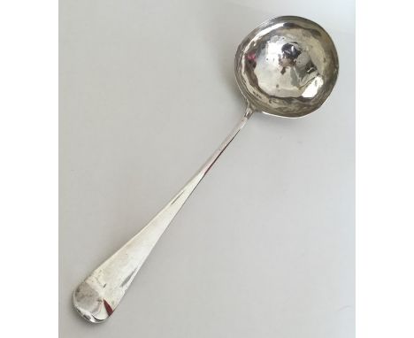A large silver soup ladle with crested terminal. London 1769. By Ebenezer Coker. Approx. 107 grams. Est. £50 - £80.