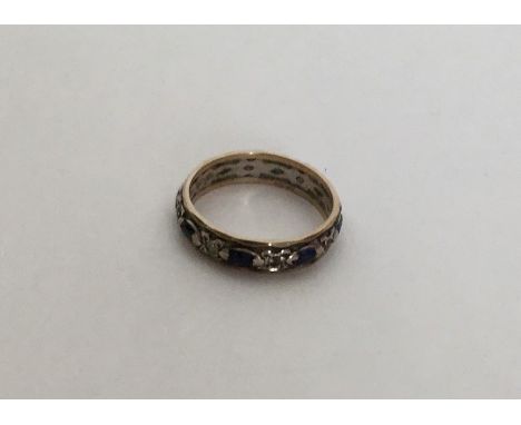 A sapphire mounted and 9 carat eternity ring. Approx. 2 grams. Est. £20 - £30.