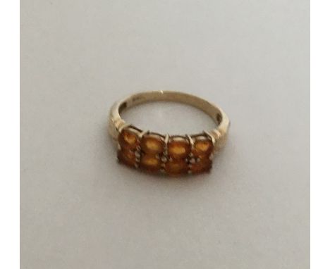 A two row gold gem set ring. Approx. 2.8 grams. Est. £50 - £80.