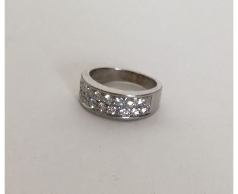An 18 carat gold diamond two row ring. Approx. 6 grams. Est. £150 - £250.