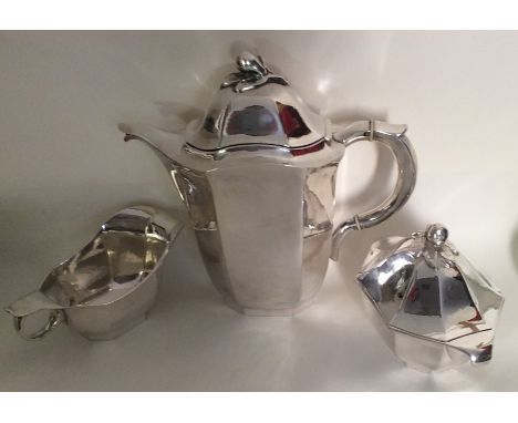 A stylish Swedish three piece Art Deco tea service with panelled sides with leaf and pear finial. 1948. By GAB. Approx. 910 g