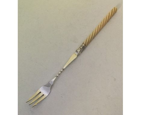 A good silver pickle fork with turned ivory handle. Sheffield. Approx. 30 grams. Est. £20 - £30.