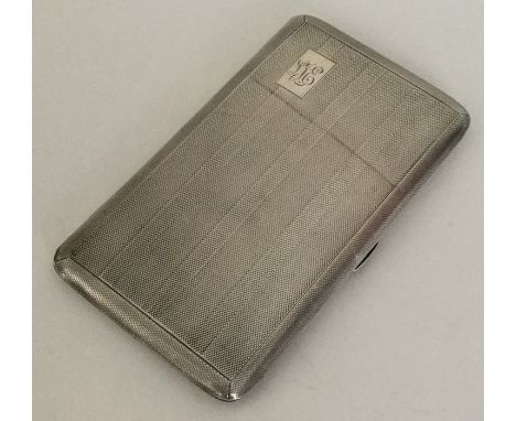 An engine turned silver hinged top cigarette case. Chester. Approx. 198 grams. Est. £50 - £80.