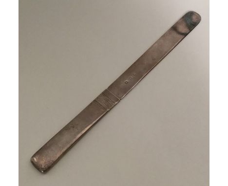A stylish silver letter opener in the form of a knife. London. By RC. Approx. 136 grams. Est. £50 - £80.