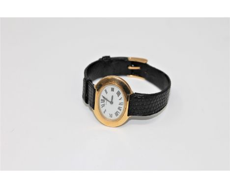 A vintage lady's 18ct gold Tiffany & Co wristwatch, on leather with strap with 18ct gold Omega buckle. 