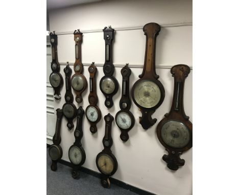 A group of twelve nineteenth century barometers, including banjo and stick examples. (12)