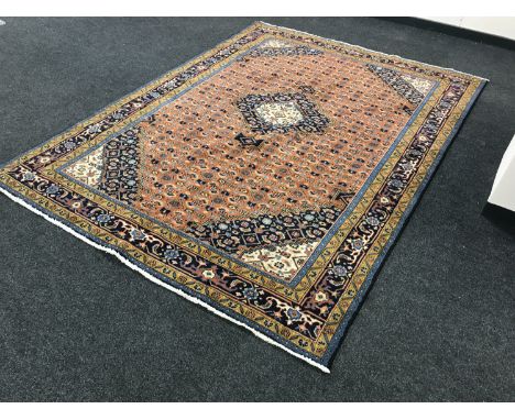 A Persian Tabriz design carpet, 283cm by 205cm.