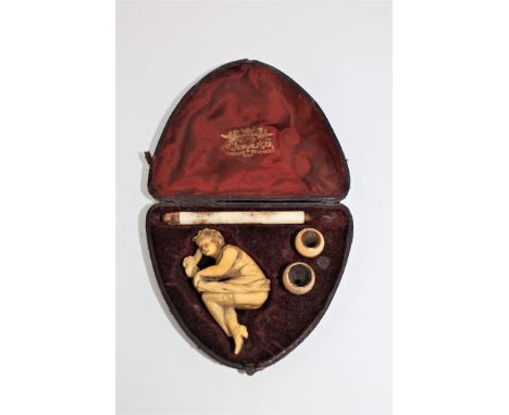 A 19th century carved erotic Meerschaum and ivory pipe, in case. CONDITION REPORT: One if the lady's feet is missing. The bir