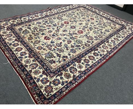 Khorasan Carpet, North East Iran, the pale field with an allover design of scrolling vines within palmette borders, 360cm by 