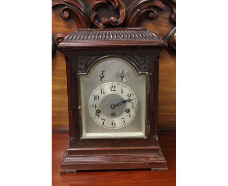 An early 20th century German bracket clock with pendulum and key. 