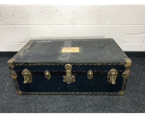 An early 20th century brass bound shipping trunk.