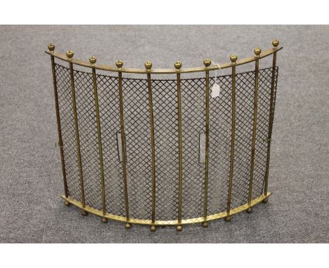 A 19th century brass fireguard.