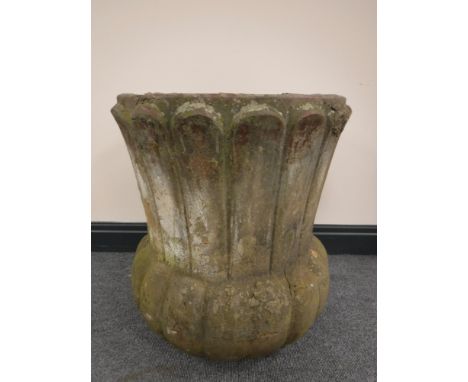 A concrete garden planter, height 56cm.