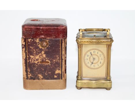 An early twentieth century French striking and repeating gilt brass carriage clock, retailed by Reid & Sons, with original tr