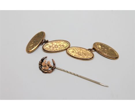 A pair of 9ct gold oval cufflinks, 3.5g, together with a Victorian stick pin.