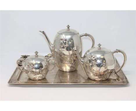 A four piece silver tea service, comprising of twin-handled serving tray, teapot, coffee pot and twin-handled sugar pot, the 