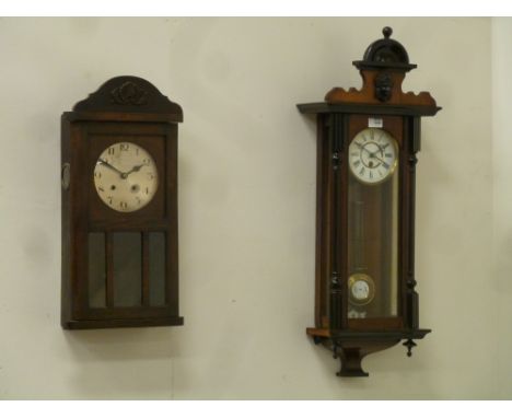 Early 20th century stained pine wall hanging clock with shaped top pediment (H84cm), and another early 20th century oak cased