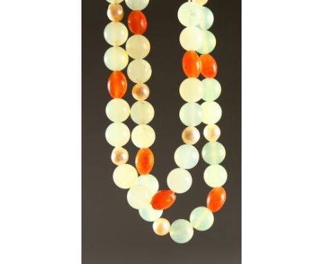 A LONG JADE TWO COLOUR NECKLACE with SIXTEEN PEARLS and gold clasp. 2ft 6ins long.