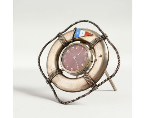A RARE SILVER LIFE RING with enamel flag and rope decoration around a watch. 3.5cms.