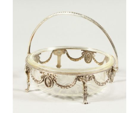 A VICTORIAN CAST SILVER FRAMED BUTTER DISH with star base, the frame with garlands and claw feet. London 1882. Maker R. M. &a