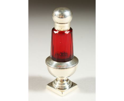 A VICTORIAN RUBY GLASS PEPPER POT SCENT BOTTLE with silver top and pedestal base. Birmingham 1899. 8.5cms high.