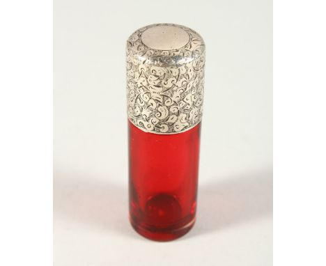 A VICTORIAN PLAIN RUBY GLASS SCENT BOTTLE with engraved silver screw off cap. London 1887. Maker SAMPSON &amp; MORDAN. 8cms l